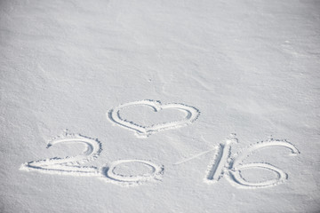 2016, new year text in fresh snow