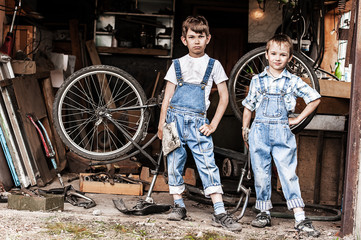 Fototapeta na wymiar Children mechanics, bicycle repair