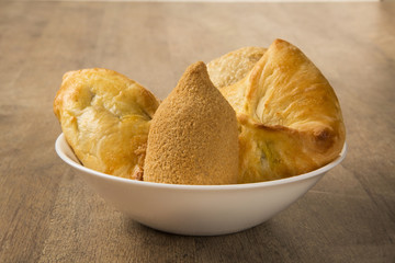 Mixed Brazilian deep fried chicken snack,, esfihas and pastry.