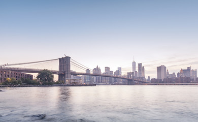 Fototapeta na wymiar Brooklyn Bridge and Manhattan in rose quartz and serenity colors.