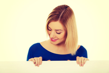 Happy woman with blank board.