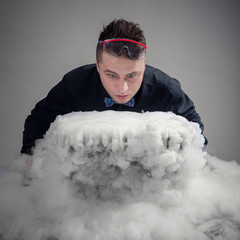 magician in chemical laboratory prepares magical solution