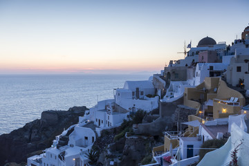 View of Oia traditional white houses of Oia at sunset in Santori