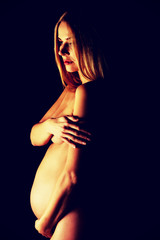 Pregnant woman looking down