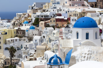 Blue domed churches on the Caldera at Oia on the Greek Island of