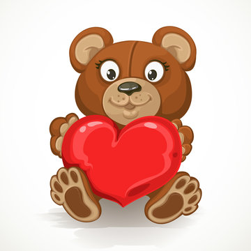 Teddy bear holding a heart isolated on white background