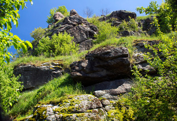top of the mountain with grass around