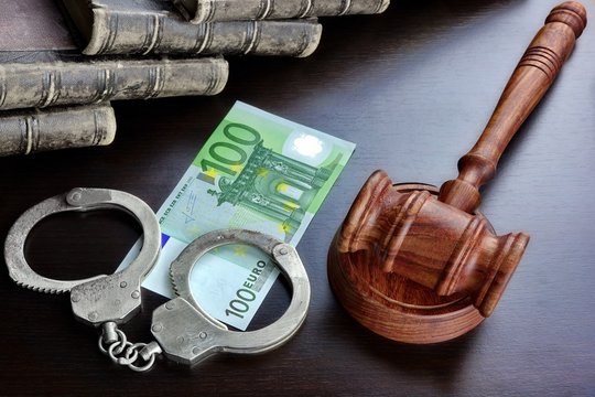 Judges Gavel, Handcuffs, Euro Cash And Book On  Black Table