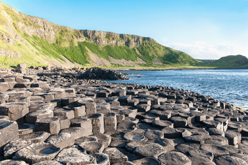 Giants Causeway, unique geological formation of rocks and cliffs in Antrim County, Northern Ireland, in sunset light