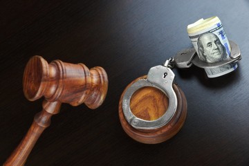 Judges Gavel And Dollar Cash  On The Black Table