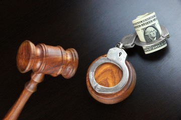 Judges Gavel And Dollar Cash  On The Black Table