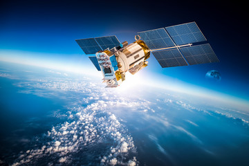 Naklejka premium Kosmiczny satelita nad planetą Ziemią