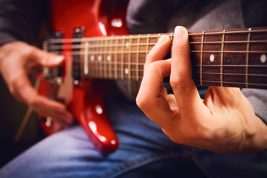 A men playing guitar