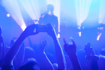 Silhouettes of people and musicians