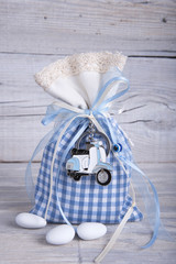 Fabric pouch wedding favor on old wooden table