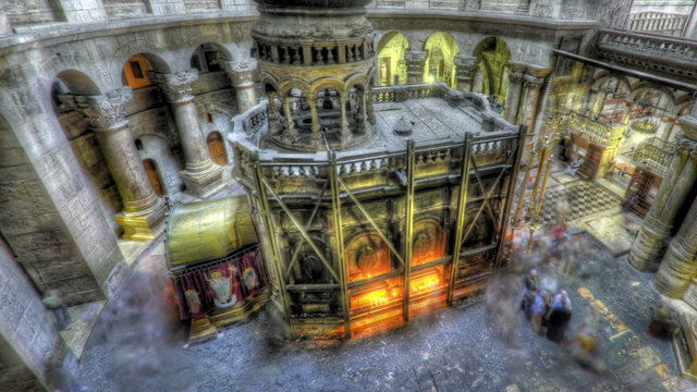 Panning shot of Shot of the Edicule of the Holy Sepulchral time-lapse of tourists walking around.