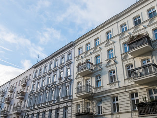 Fototapeta na wymiar Long row of apartments with balconies