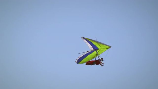 Shot of hang glider flying through the air.