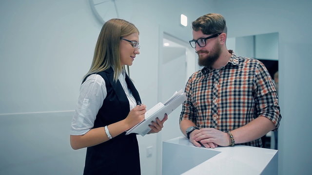 Young guy communicating with an administrator
