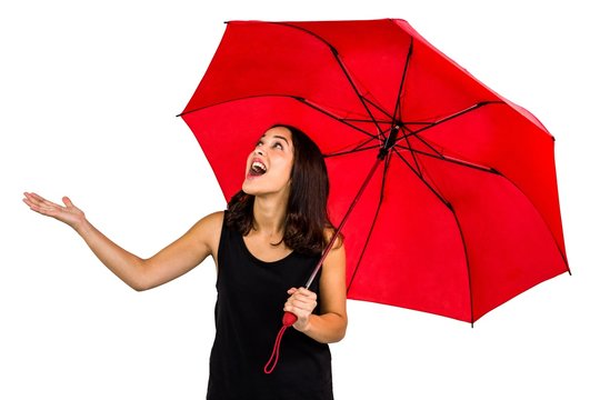 Shocked Woman Looking Up While Holding Red Umbrella