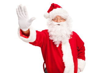 Naklejka premium Santa Claus making a stop gesture