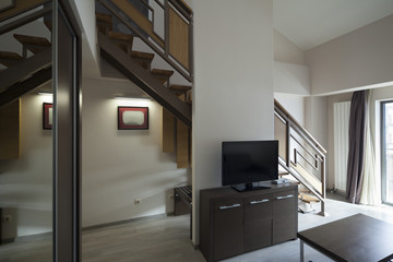 Fototapeta na wymiar staircase in duplex apartment interior
