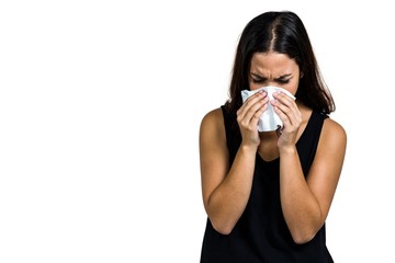 Unhappy woman blowing nose 