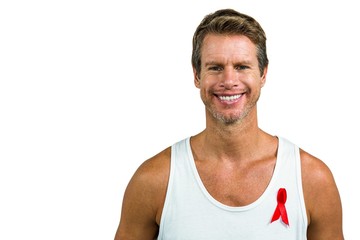 Portrait of man wearing aids ribbon on vest 
