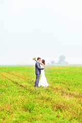 young wedding couple, beautiful bride with groom portrait, summer nature outdoor