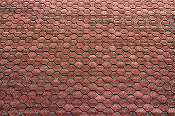 red hexagonal tiles on the roof as a background
