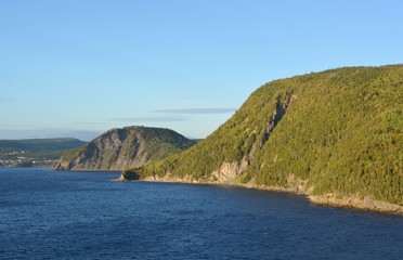 Fototapeta na wymiar view from the ocean towards the Humber Arm shoreline near the Skeleton Cove, Newfoundland Canada 