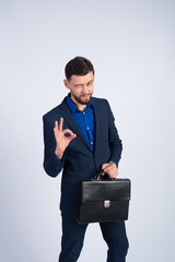 Young businessman with a black briefcase