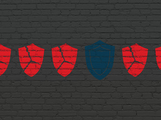 Privacy concept: shield icon on wall background