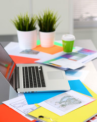 Designer working at desk using digitizer in his office