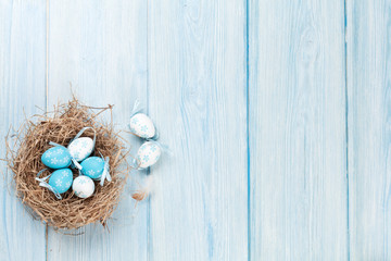 Easter background with eggs in nest