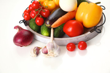 Composition with assorted raw organic vegetables on table