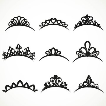 Set of silhouettes of tiaras of various shapes on a white backgr