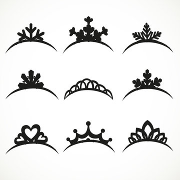 Set of silhouettes of tiaras of various shapes on a white backgr