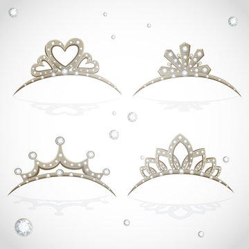 Shining gold tiaras with diamonds isolated on a white background