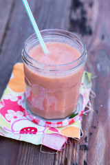 Fresh and organic smoothie (kiwi, mango, banana, strawberry) - perfect vitamin bomb for healthy eating or dieting. Natural light. Selective focus.
