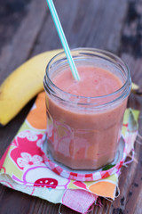 Fresh and organic smoothie (kiwi, mango, banana, strawberry) - perfect vitamin bomb for healthy eating or dieting. Natural light. Selective focus.