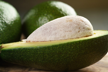 ripe avocados on olive cutting board