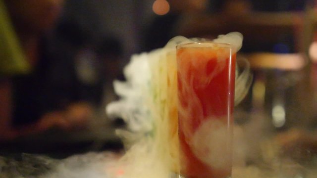 Smoky Colourful Cocktails with White Smoke in Bar