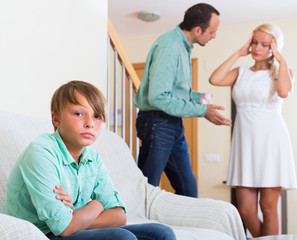 Son suffering of parents argue.