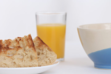 close up of a breakfast with toast and orange juice full of vitamins