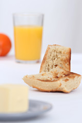 close up of a breakfast with toast and orange juice full of vitamins