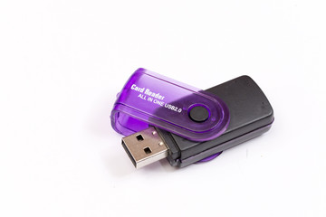 Black plastic memory card reader over white