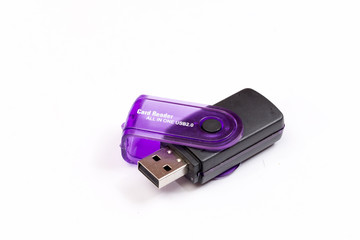 Black plastic memory card reader over white