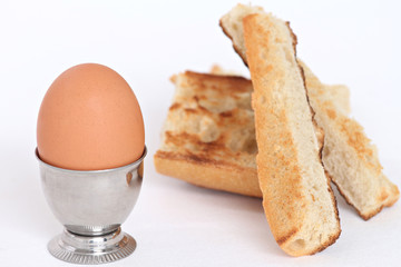 close up of an egg shell and toasted bread slices
