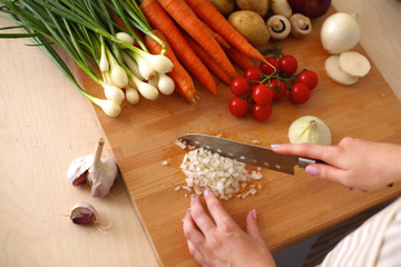 Young Woman Cooking in the kitchen. Healthy Food